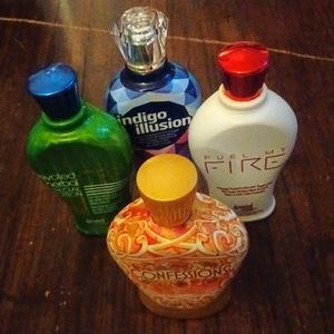 Four bottles of of some of the best salon tanning lotion.